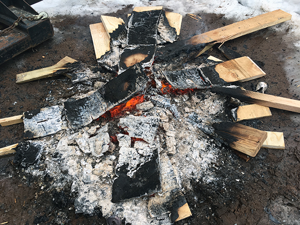 burning wood scraps from the job site