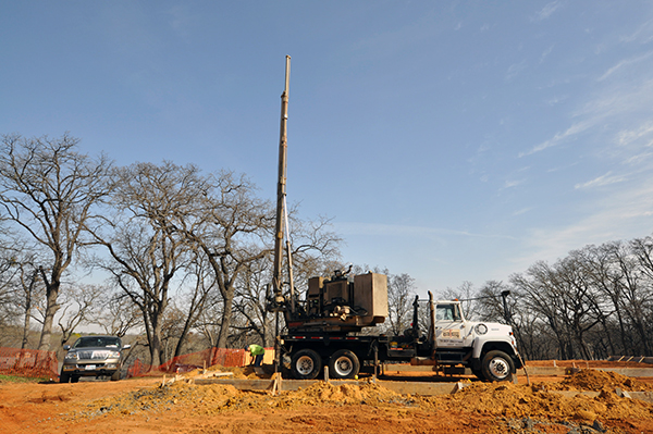 CHouse Modern site work drilling piers