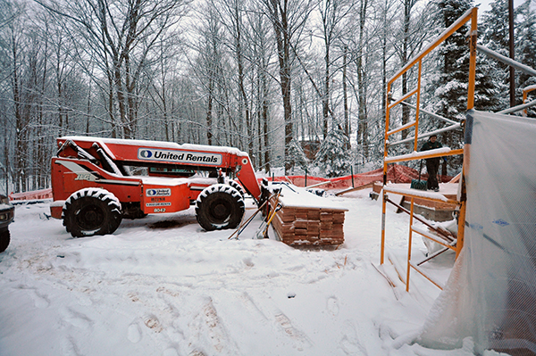 construction equipment covered in snow