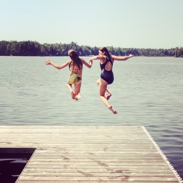 Kate and Mo jumping off a dock