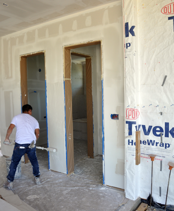 Level 5 drywall finish - rolling on the drywall mud