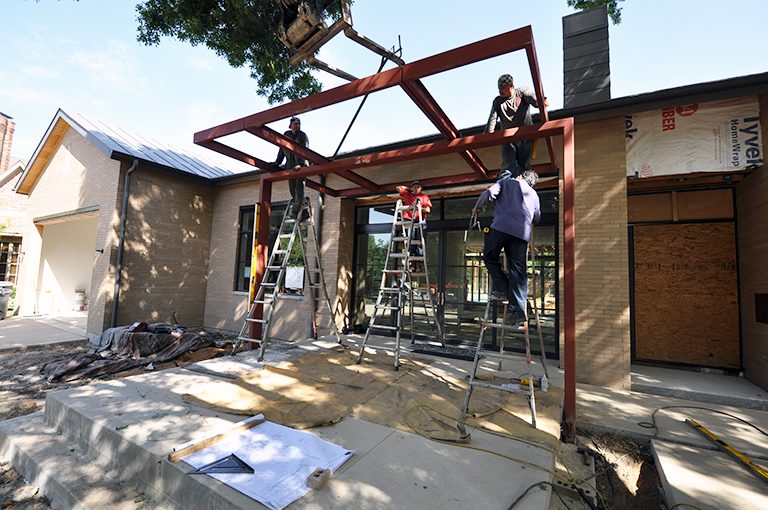 moving the top of the trellis into position