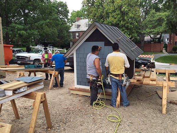 The Cottage House installing the siding