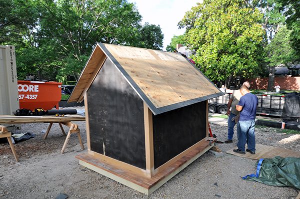 The Cottage House installing the flashing for the metal roof