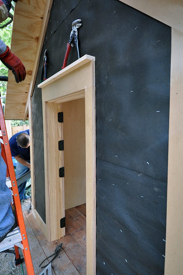 The Cottage House underlayment for the hardiboard siding