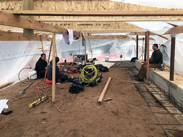 Workers sitting in the tented area