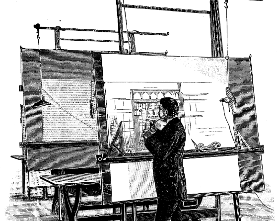 Architect standing in front of a drafting table